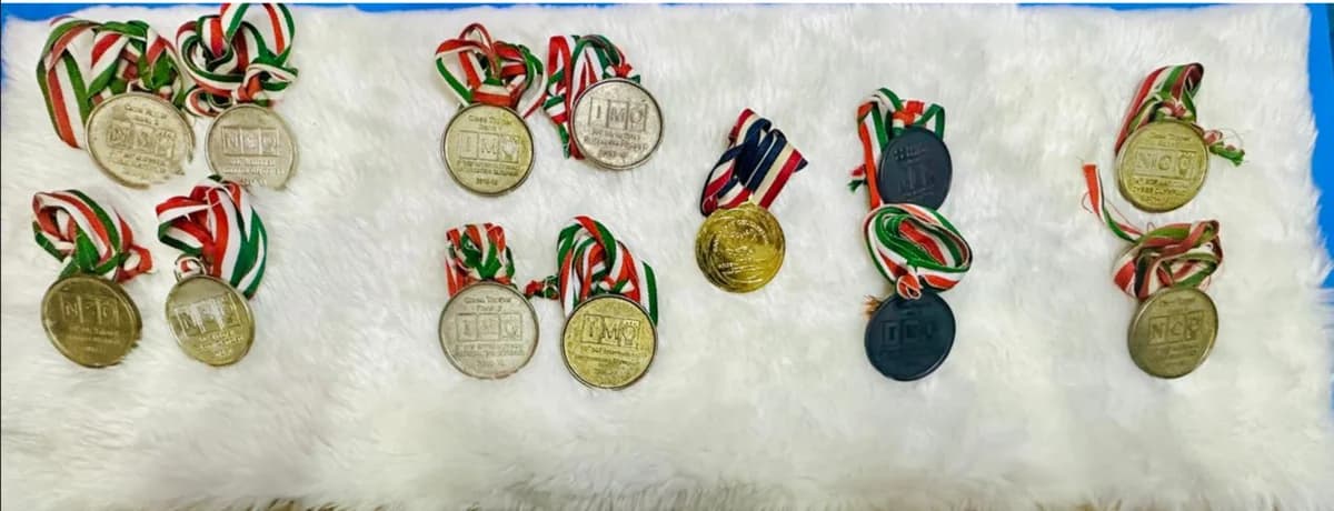 Om's Olympiad medals arranged with their ribbons